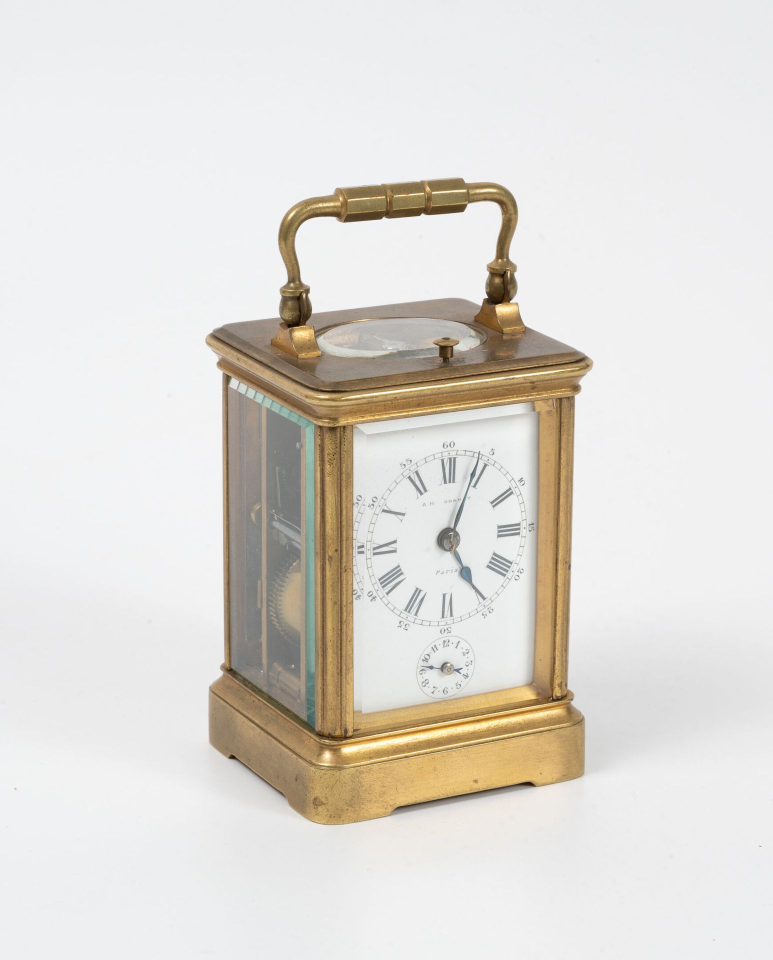 Null Officer's clock in gilded metal. 
Rectangular cage with four glass sides an&hellip;