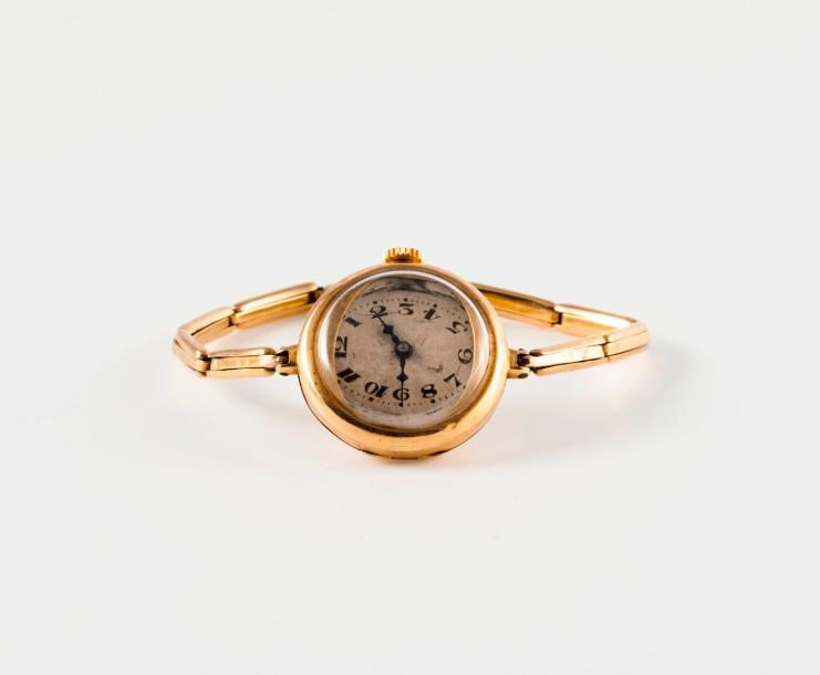 Null Montre bracelet de dame en or jaune (750).

Boîtier circulaire.

Cadran arg&hellip;