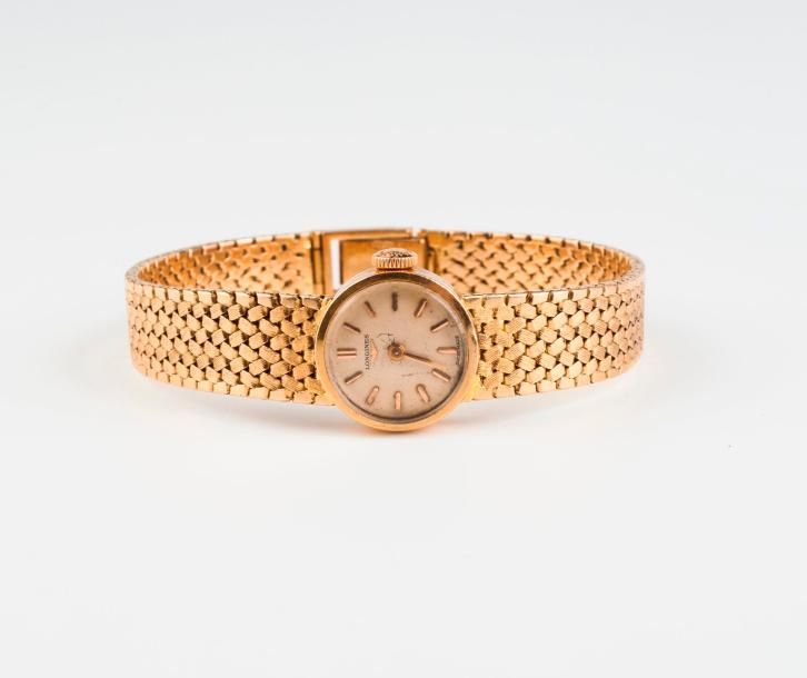 LONGINES 

Montre bracelet de dame en or jaune (750).

Boitier circulaire.

Cadr&hellip;