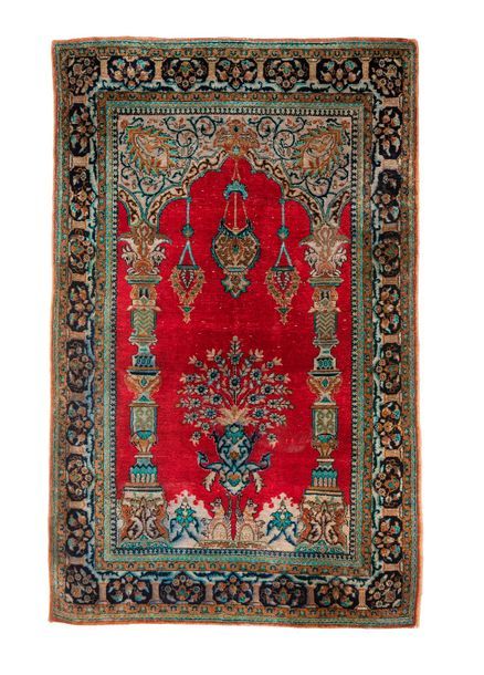 IRAN, XXème siècle 
Tapis en laine polychrome centré d'un mihrab à fond rouge, à&hellip;