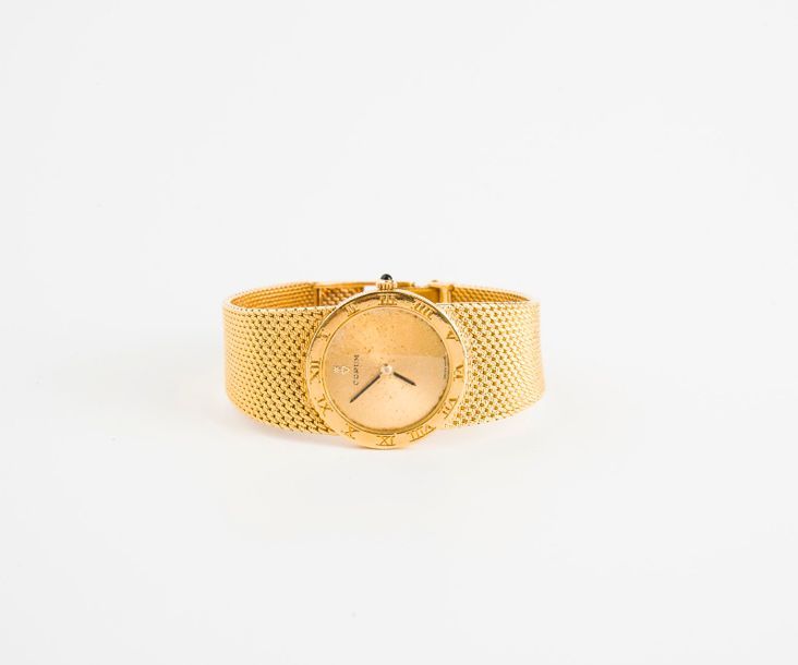 CORUM 

Montre bracelet de dame en or jaune (750) 

Boîtier rond, lunette avec i&hellip;