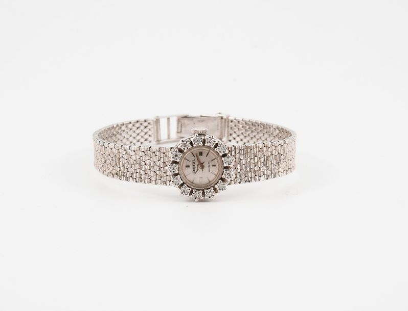 JOPAL 

Montre bracelet de dame en or gris (750). 

Boîtier rond, lunette sertie&hellip;