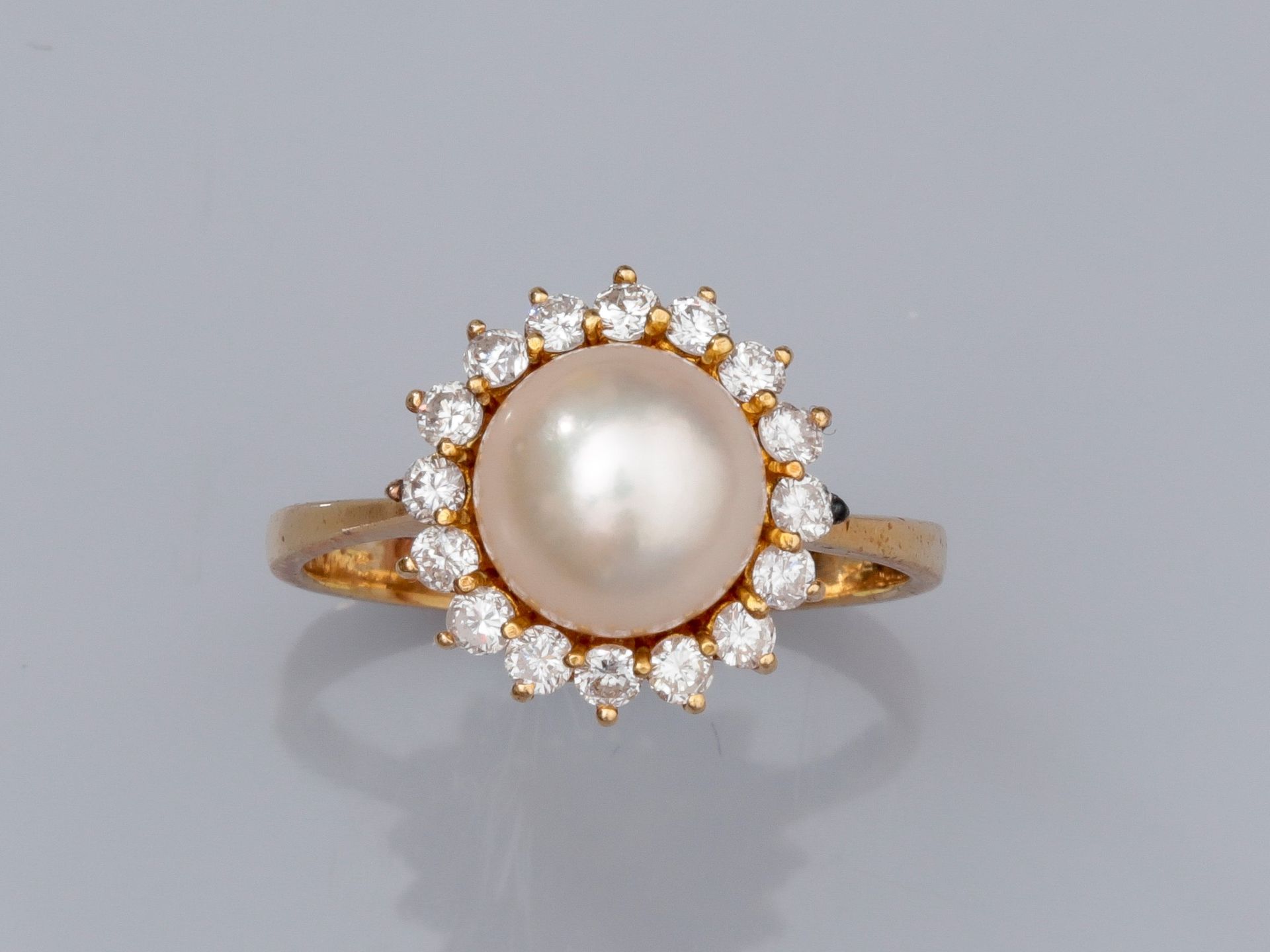 Null Ring in 18K yellow gold; set with a 9 mm Akoya cultured pearl, surrounded b&hellip;