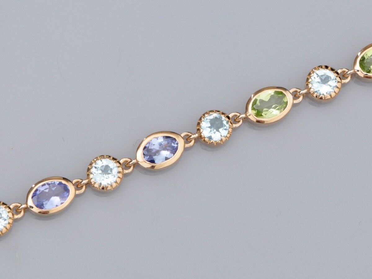 Null Bracelet in 925 silver vermeil, set with tanzanites, blue topazes and perid&hellip;