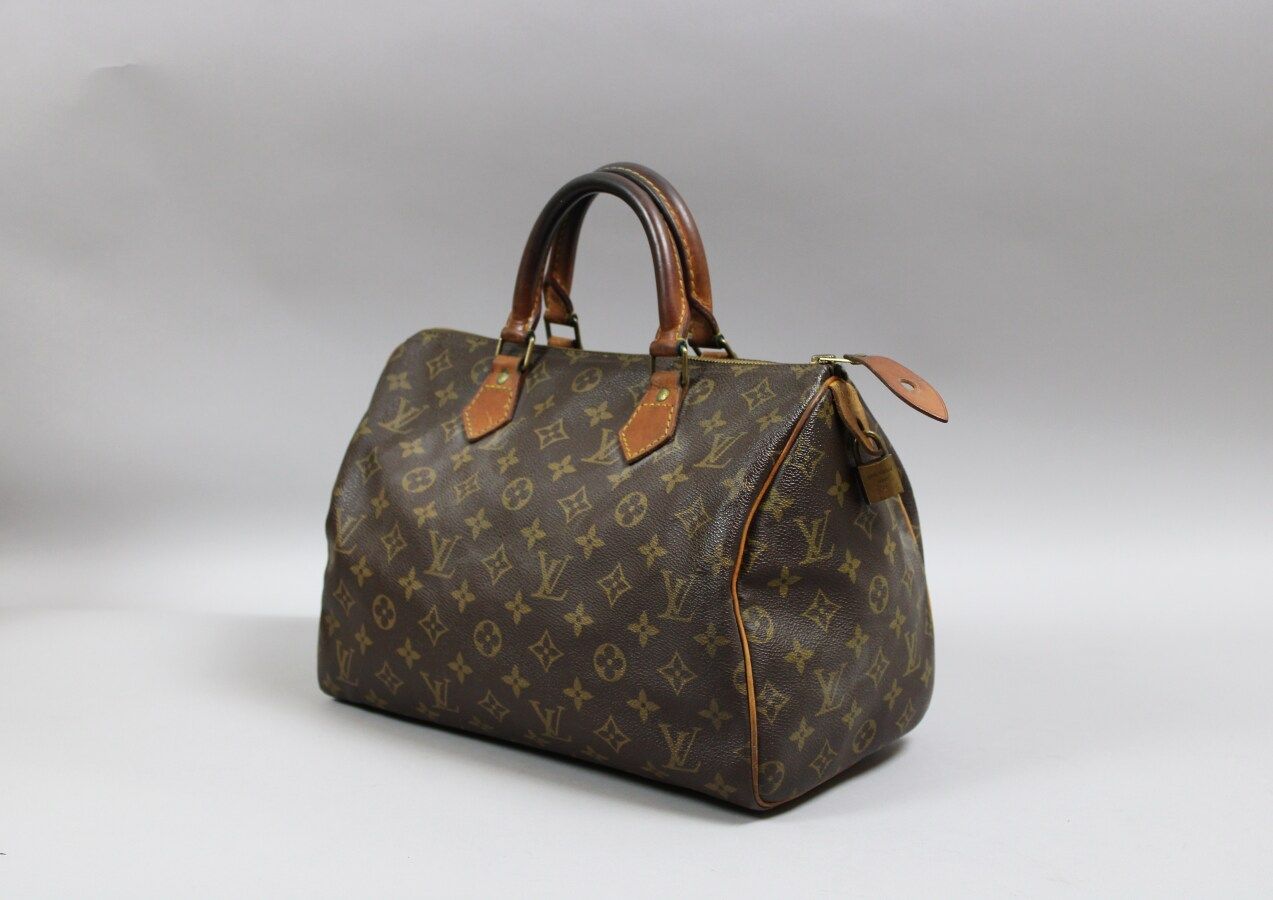 Louis VUITTON Speedy bag in Monogram canvas and natural…