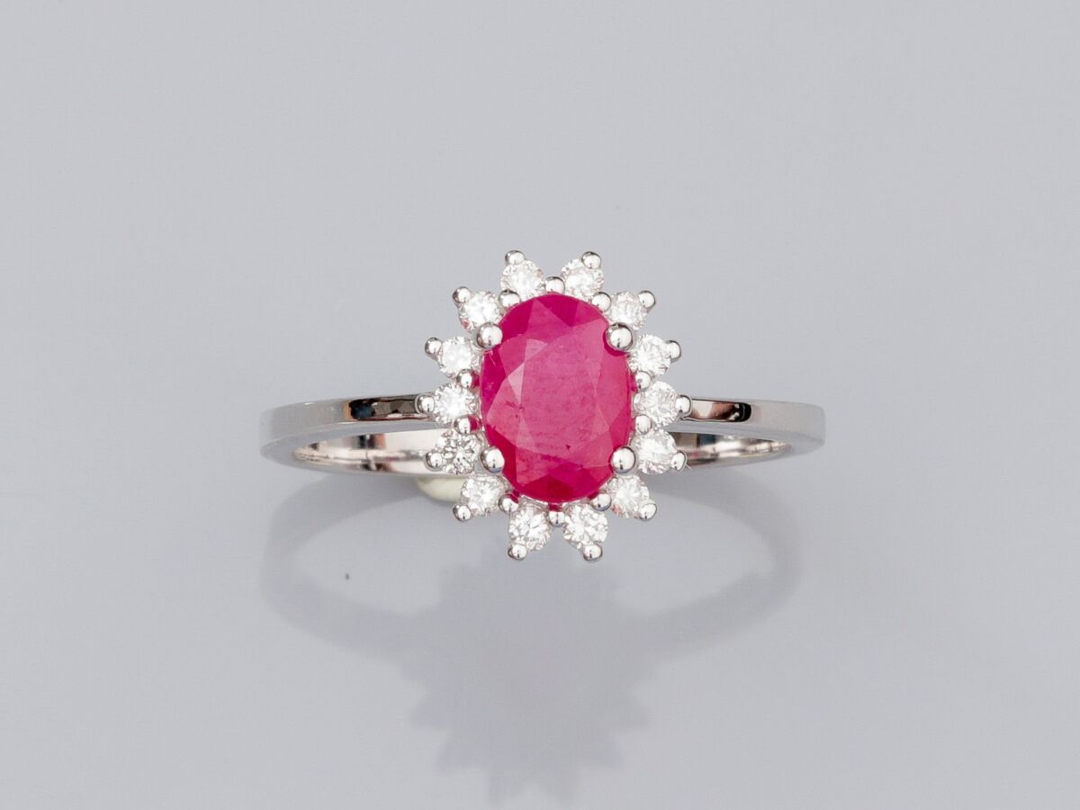 Null Ring in white gold 375°/°°(9 K), set with a round treated oval ruby, surrou&hellip;
