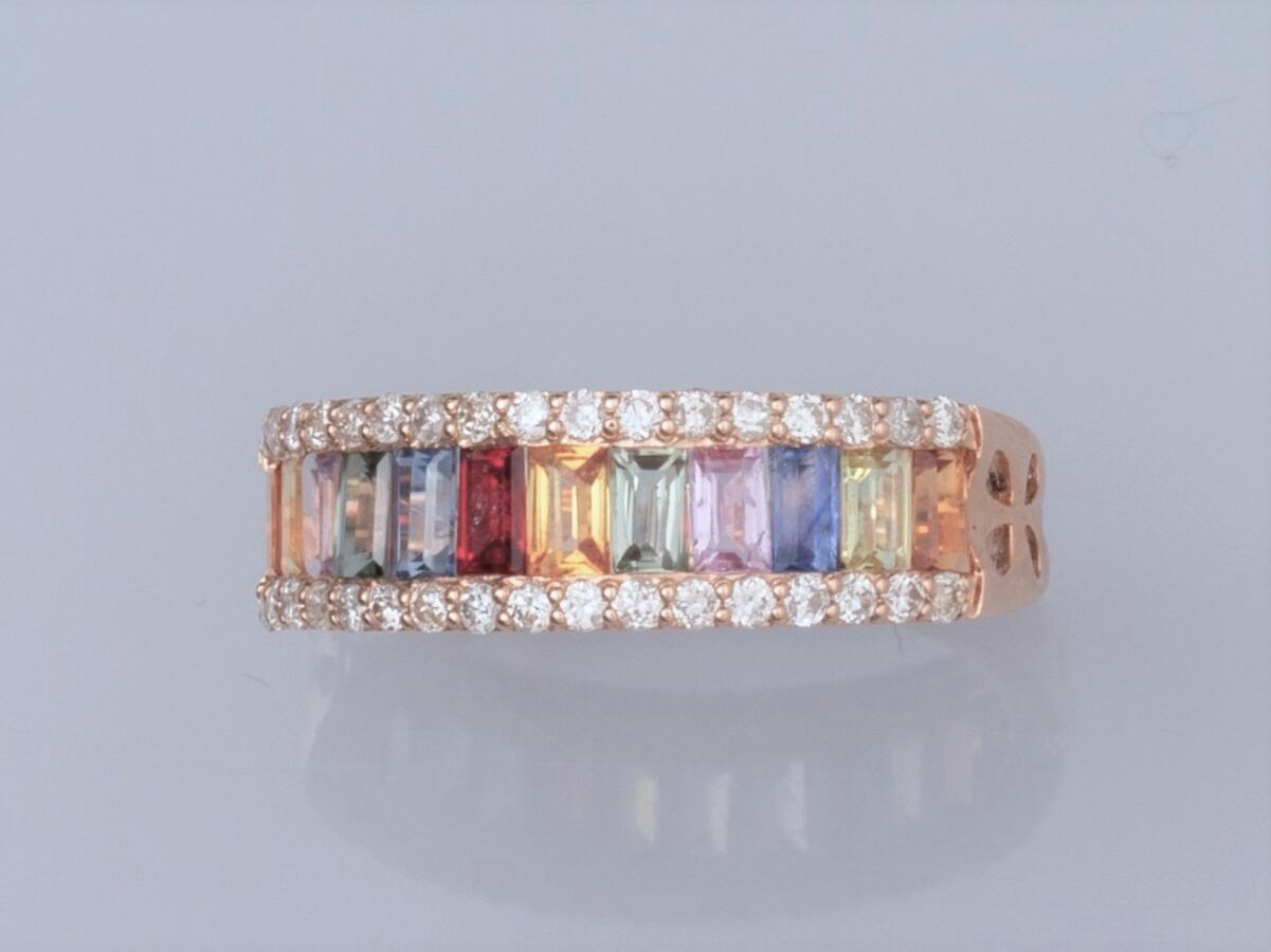 Null Ring in 18K pink gold, set with a line of multi-colored calibrated sapphire&hellip;