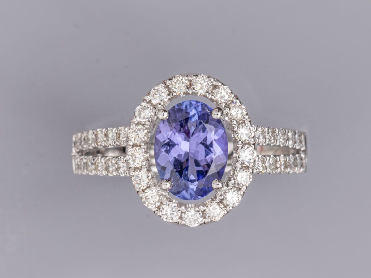 Null Ring in 18K white gold, set with an oval tanzanite weighing approximately 1&hellip;