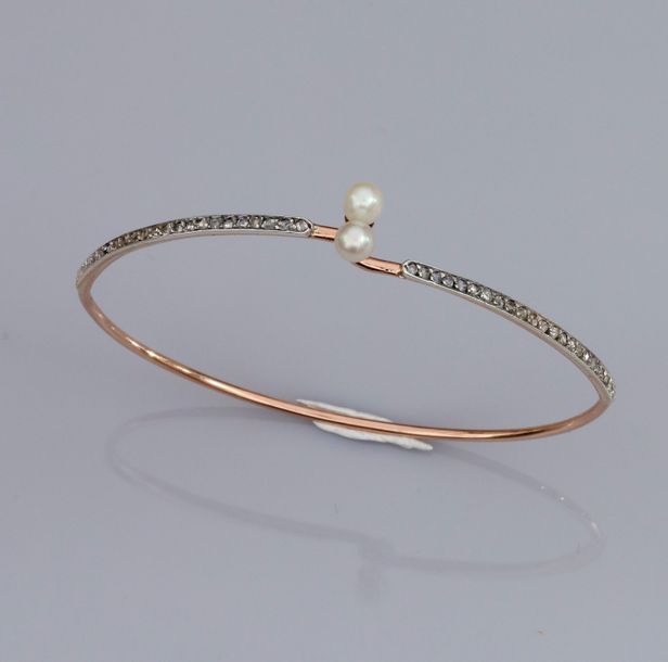   Fin bracelet rigide ovale croisé en or deux tons 585°/00 (14K), serti de petit&hellip;