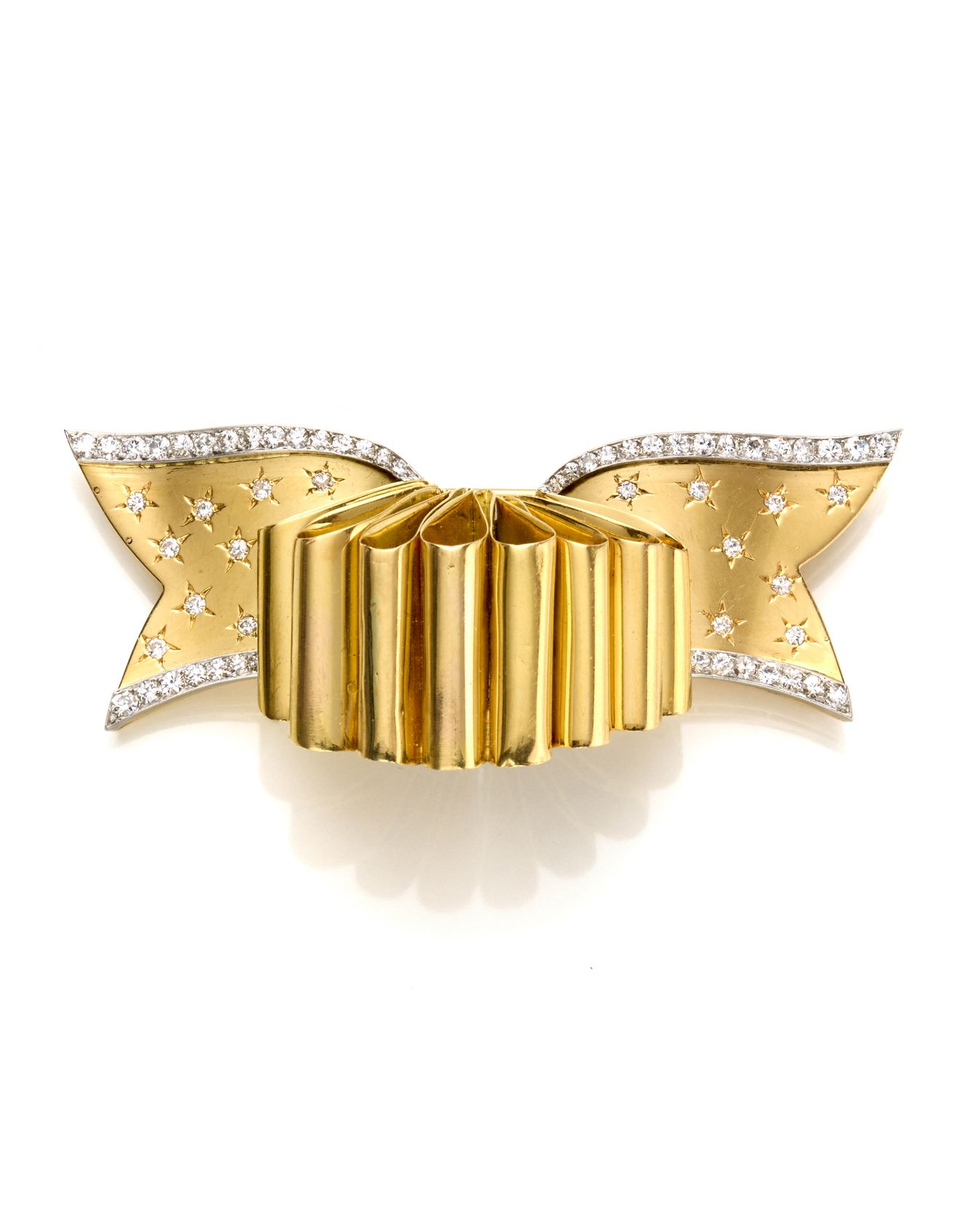 Null VAN CLEEF & ARPELS
黄金和铂金弓形胸针，饰以etoilé镶嵌钻石，重29.89克，长6.60厘米左右。签名：Van Cleef & &hellip;