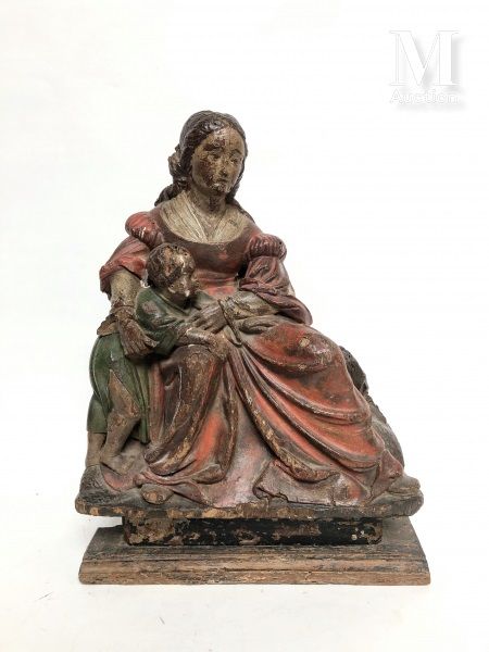 Null 多色木制的圣母和圣婴，她穿着大礼服坐着，她把站着的孩子抱在怀里，孩子紧紧抓住她的衣服。

可能是意大利，18世纪

高：33 - 宽：24,5 - 深&hellip;