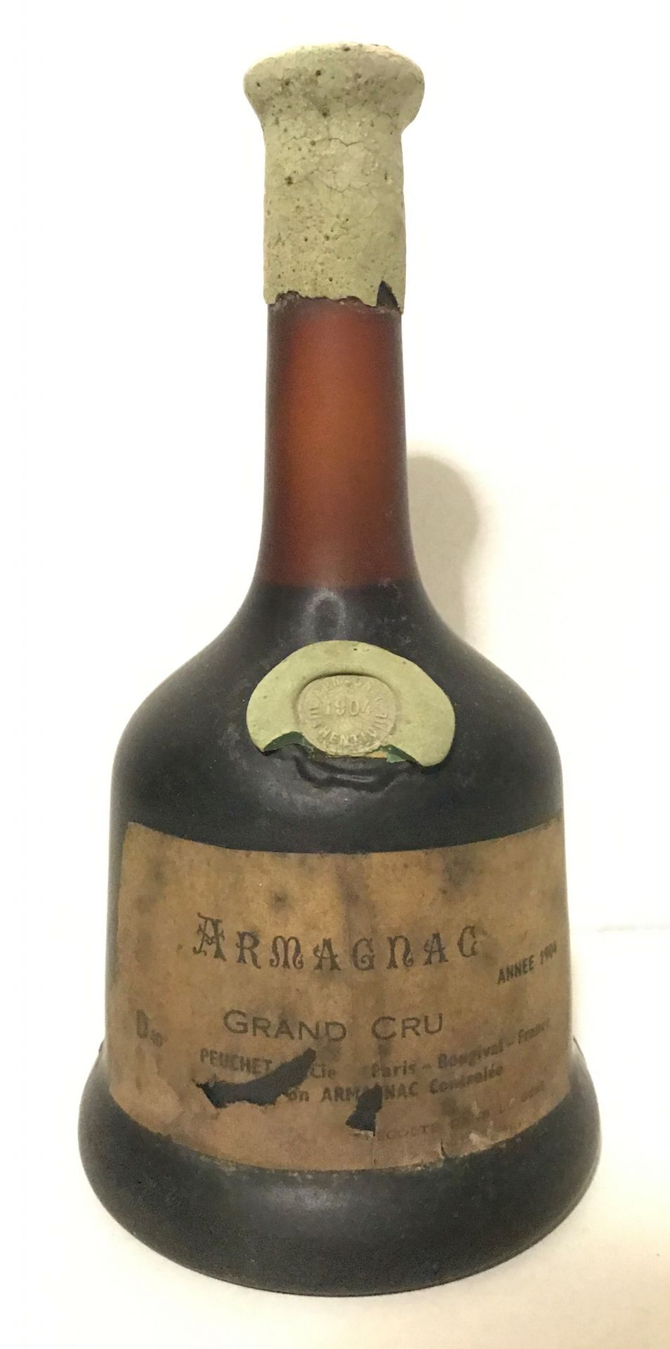 Null 1 bouteille ARMAGNAC Peuchet 1904 (étiquette abimée, bon niveau)