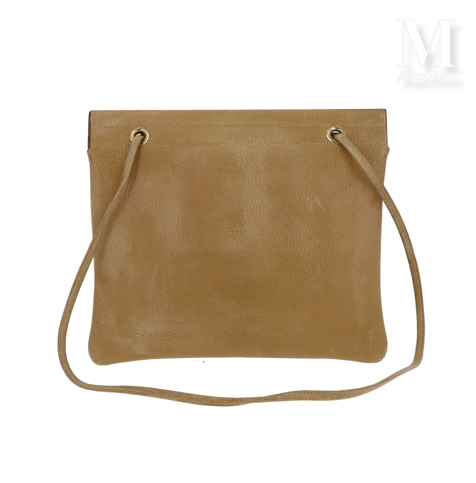 HERMÈS - 1982 Myriam" bag

in camel grained calf 

Gold plated metal trim 

31 x&hellip;