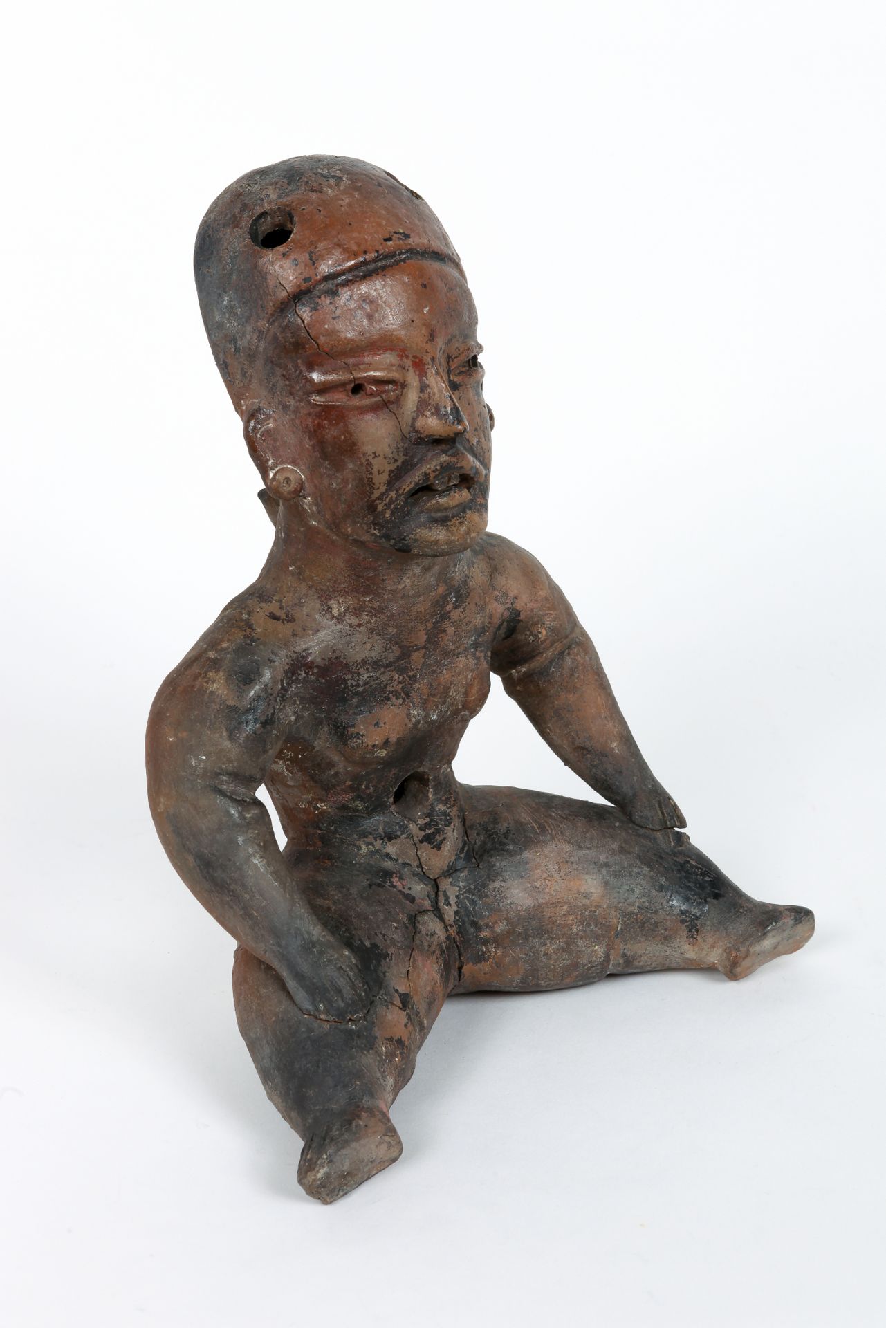 Statue baby face. 米色和棕色赤土，破损和胶合，修复。 

奥尔梅克风格，墨西哥，20世纪。

29 x 23 cm