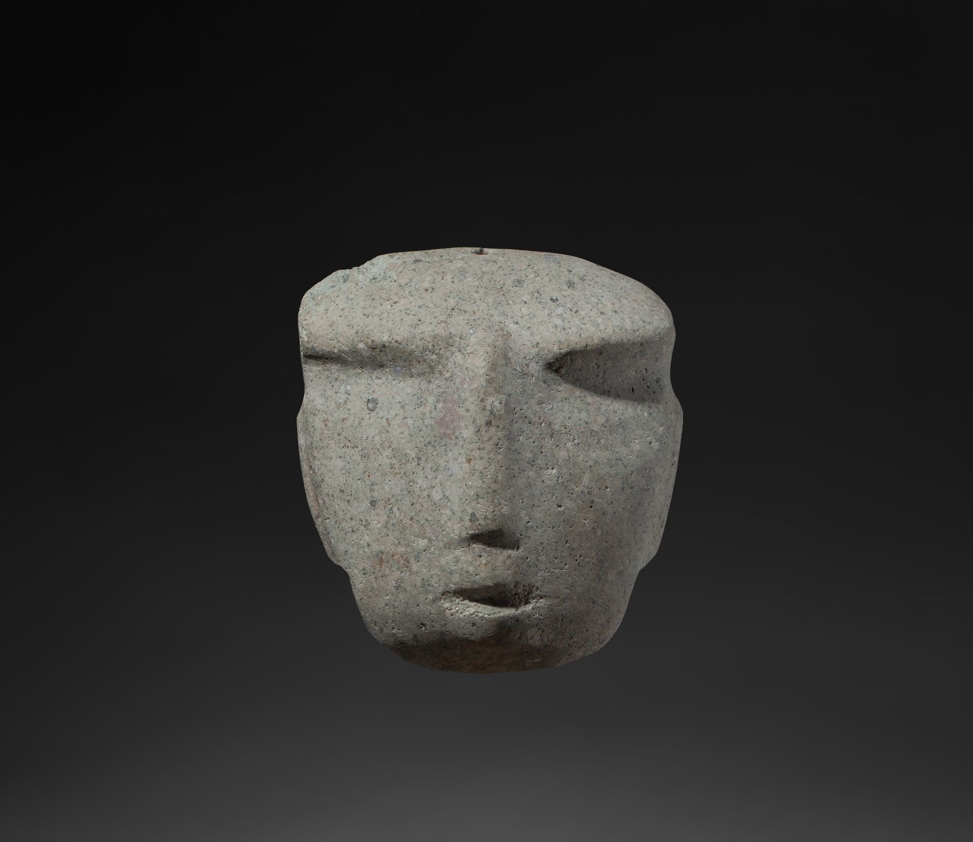 *Masque 
representing a human face. The face is square in shape and has strongly&hellip;