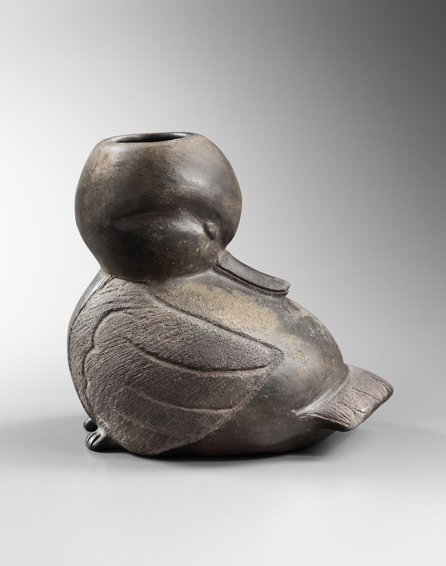*Vase représentant un canard 
The head turned and the beak resting on the back o&hellip;