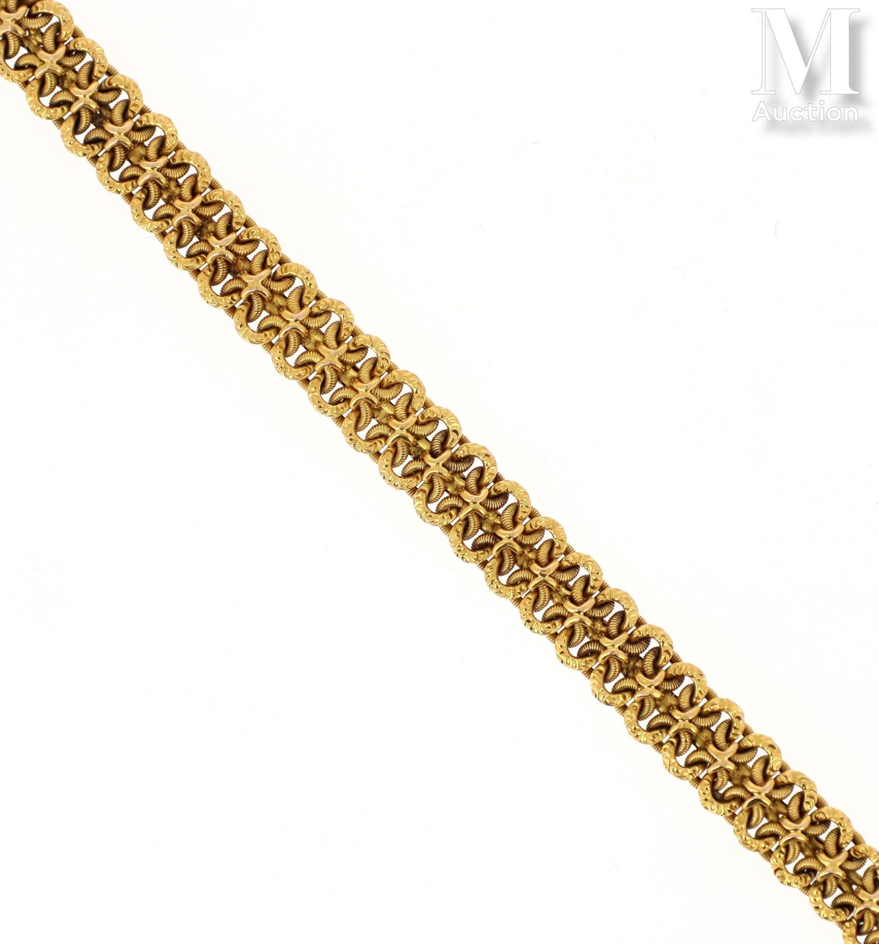 Bracelet or 18K黄金（千分之七十五）手镯，由花式网眼构成。19世纪中期的法国作品。
毛重：21.6克。长度：19厘米