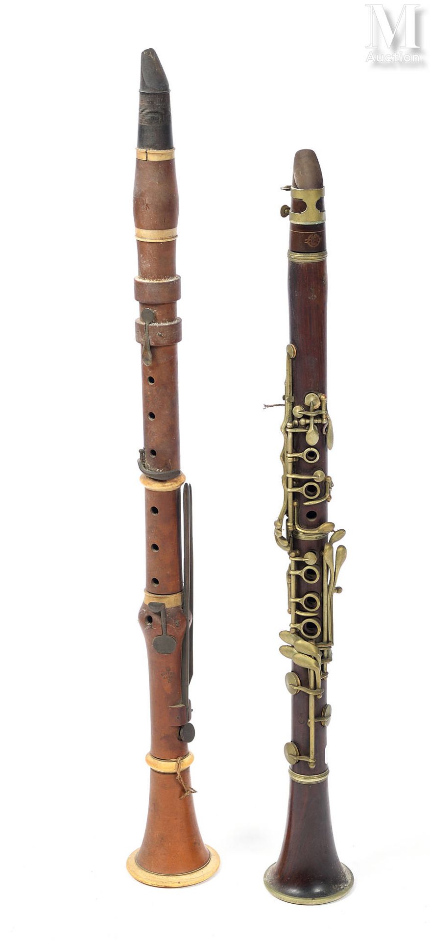 CLARINETTES A.LECOMTE
Lot de deux clarinettes, en buis et palissandre, clefs lai&hellip;