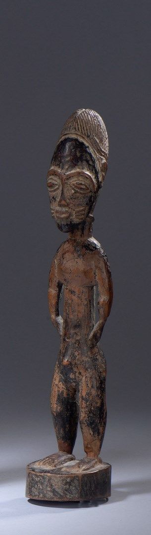 Null Baule statuette (Ivory Coast) 

Small female statuette, arms along the body&hellip;
