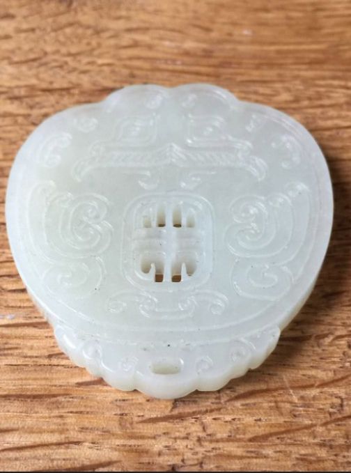 Null CHINA - 20th century

Celadon nephrite pendant with a taotie mask in light &hellip;