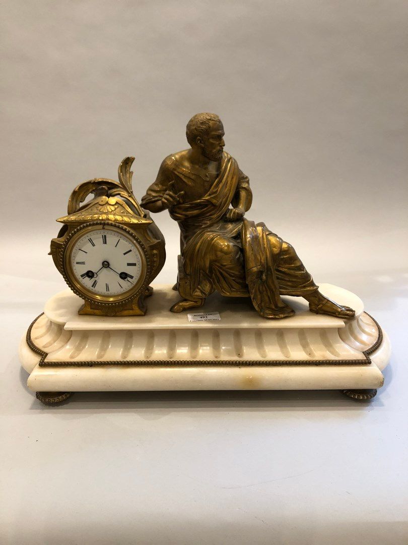 Null A white marble and gilt metal clock by Ph. MOUREY with a man dressed in the&hellip;