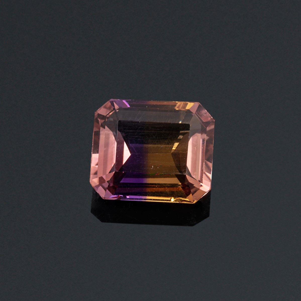 Null Rectangular ametrine with cut sides on paper. 

Weight : 12.80 cts.