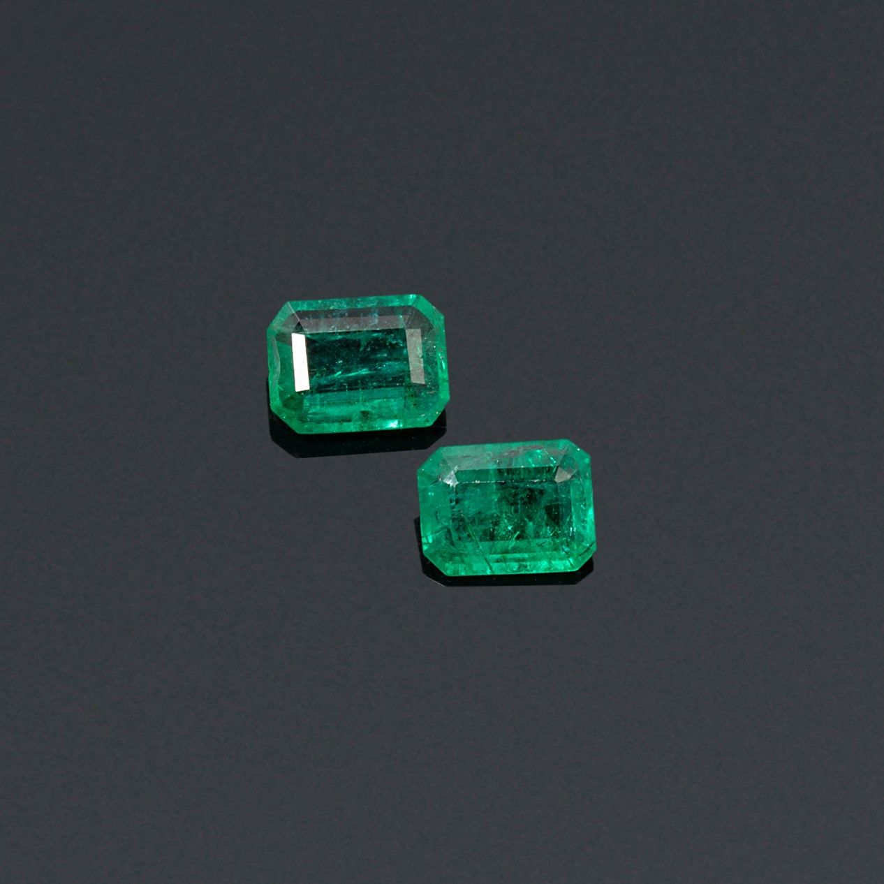 Null A pair of rectangular emeralds with cut sides on paper. 

Accompanied by an&hellip;