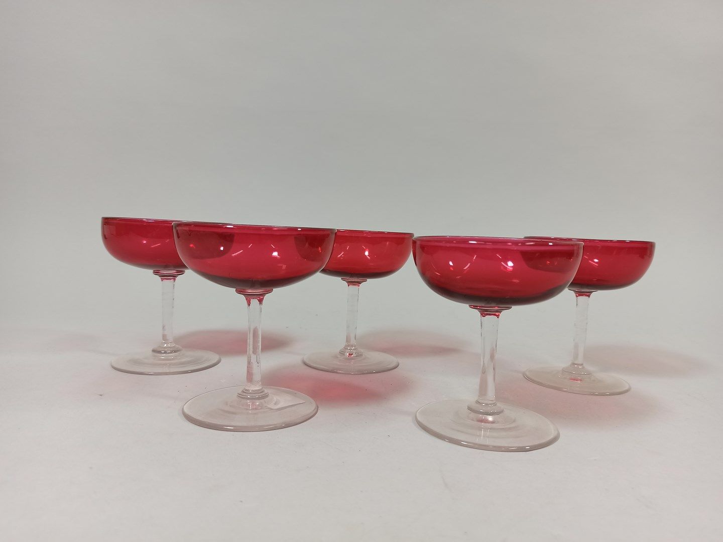 Null 5 champagne glasses in red tinted glass