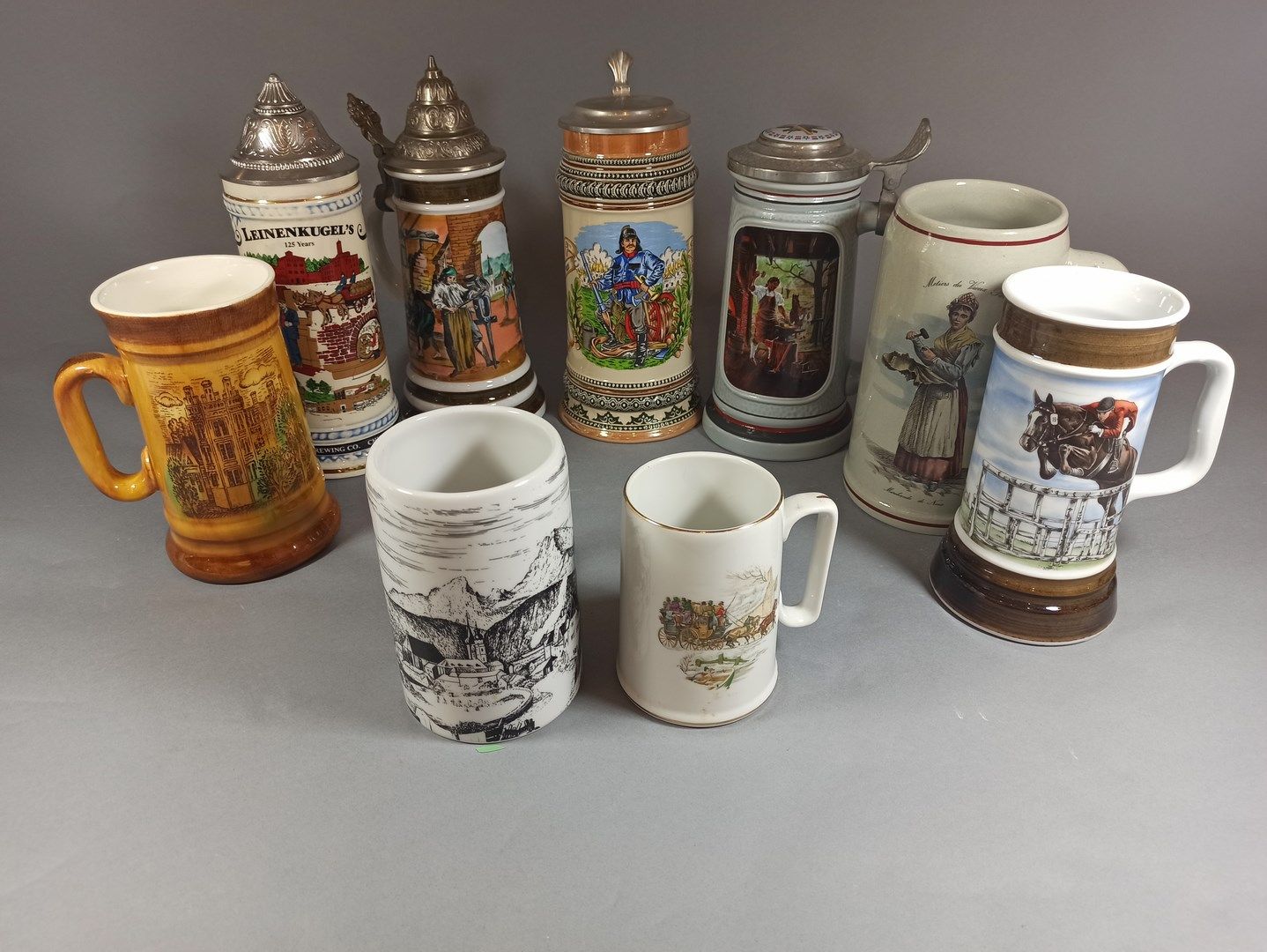 Null Set of 9 beer mugs with chromolithographed decoration.

Some with metal lid&hellip;