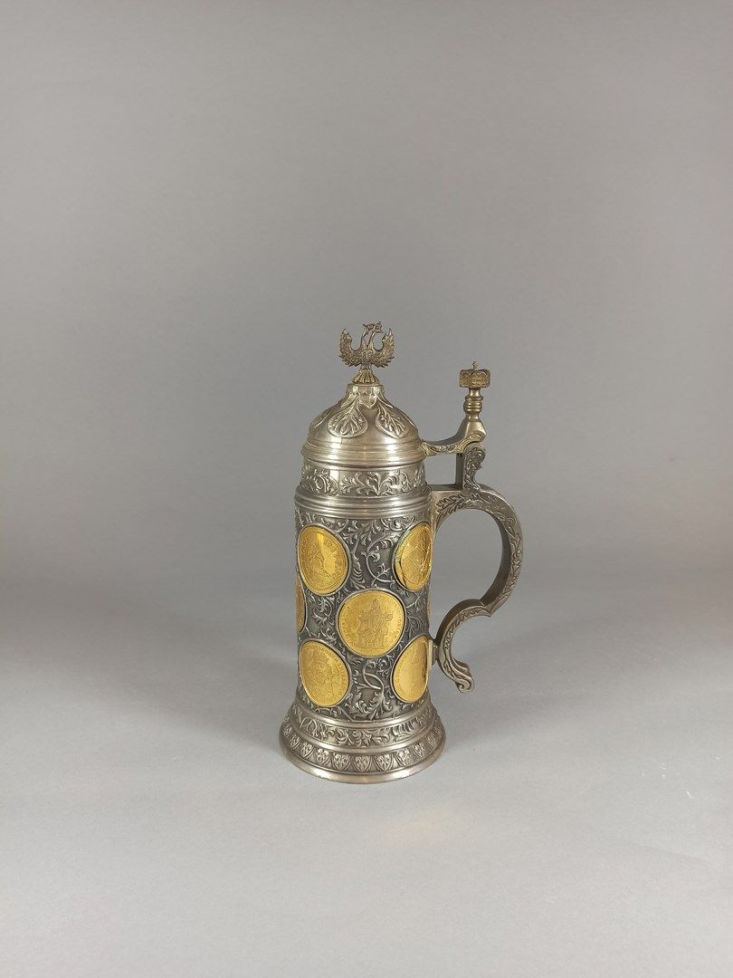 Null German work,

Commemorative pewter mug richly decorated with medals enhance&hellip;