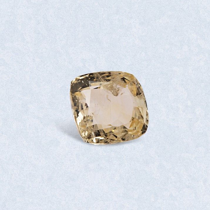Null Cushion yellow sapphire on paper. 

Accompanied by an AIG certificate indic&hellip;