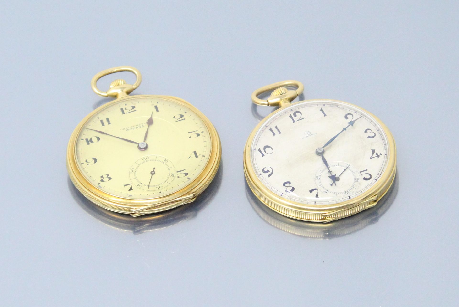 Null 选举与ETERNA

两块18K(750)黄金怀表拍品。一块是黄色表盘的手表，另一块是米白色的表盘。阿拉伯数字表示小时和分钟。

毛重：117克。- &hellip;