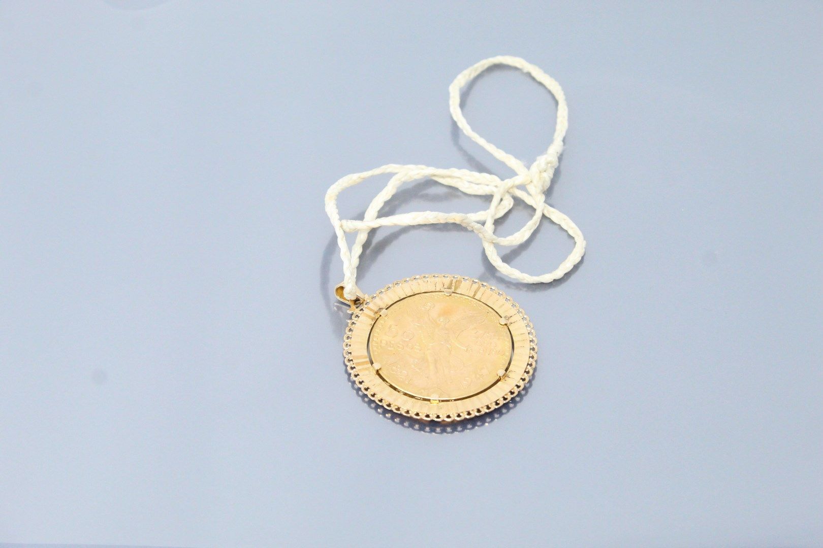 Null 18k (750) yellow gold pendant with a 50 pesos gold coin. 

Marked with an e&hellip;