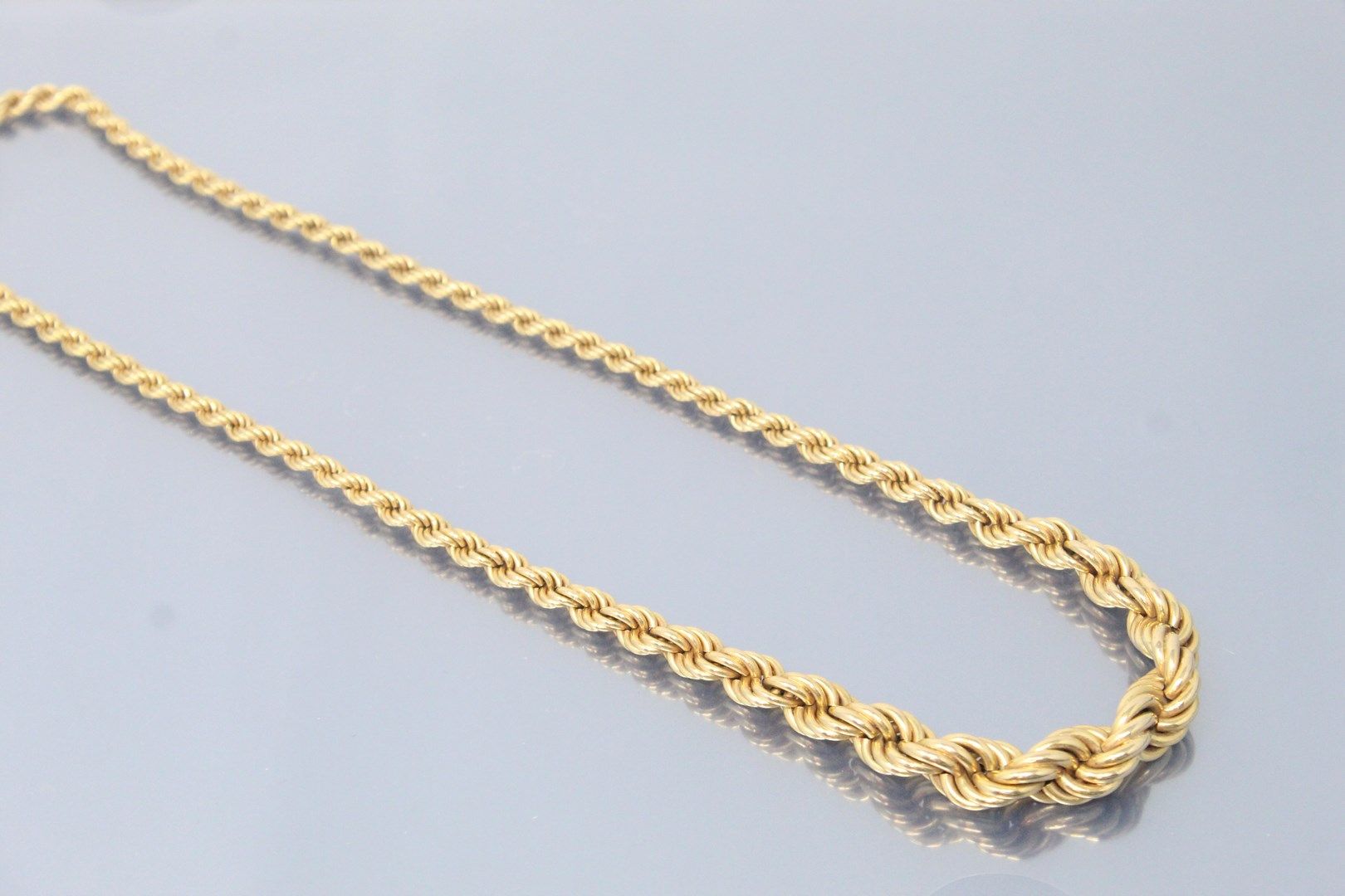 Null Necklace in 18k (750) yellow gold with a twisted mesh. 

Marked with an eag&hellip;