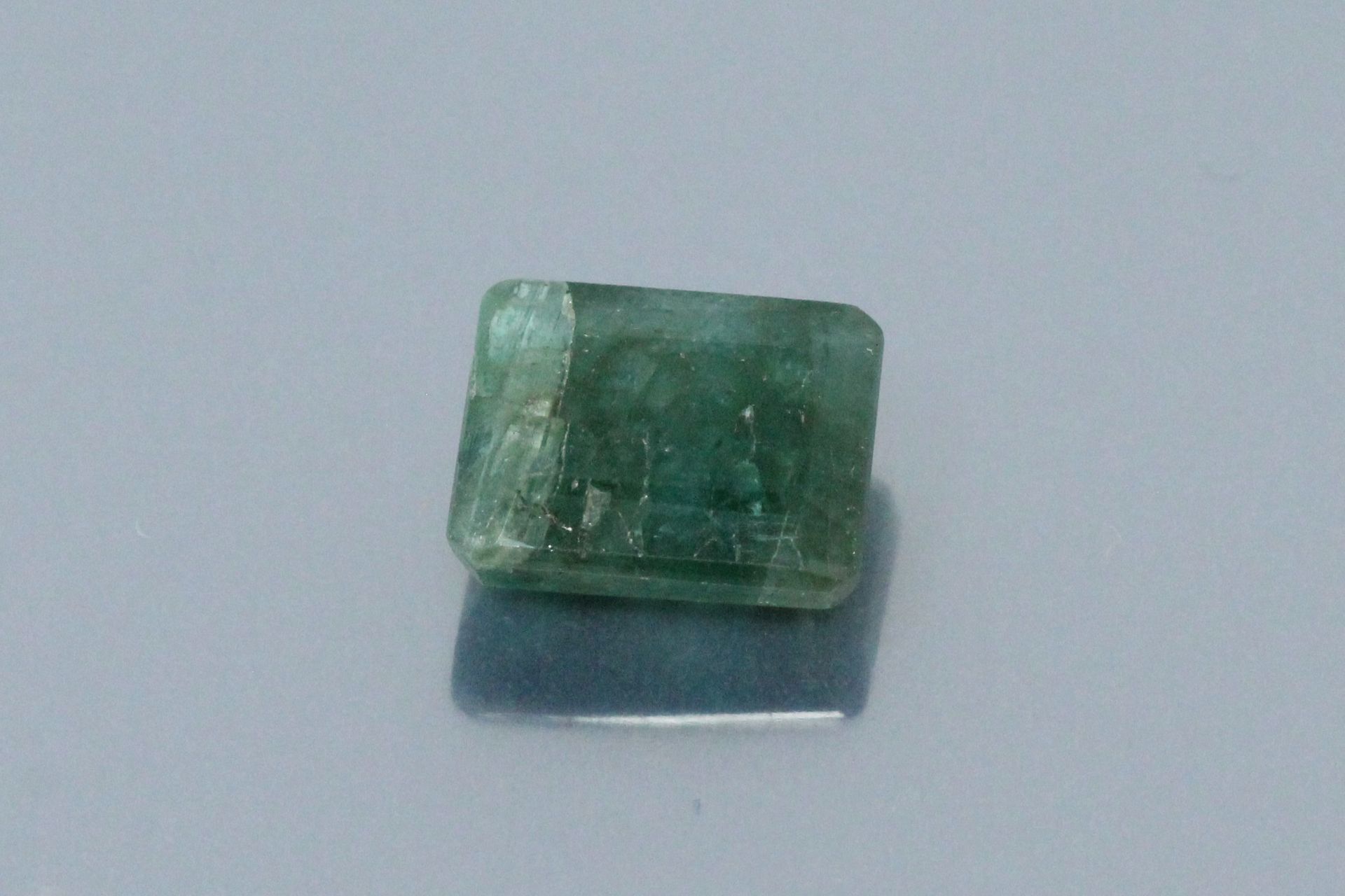 Null Emerald (root) rectangular with cut sides on paper. 

Accompanied by a GJSP&hellip;