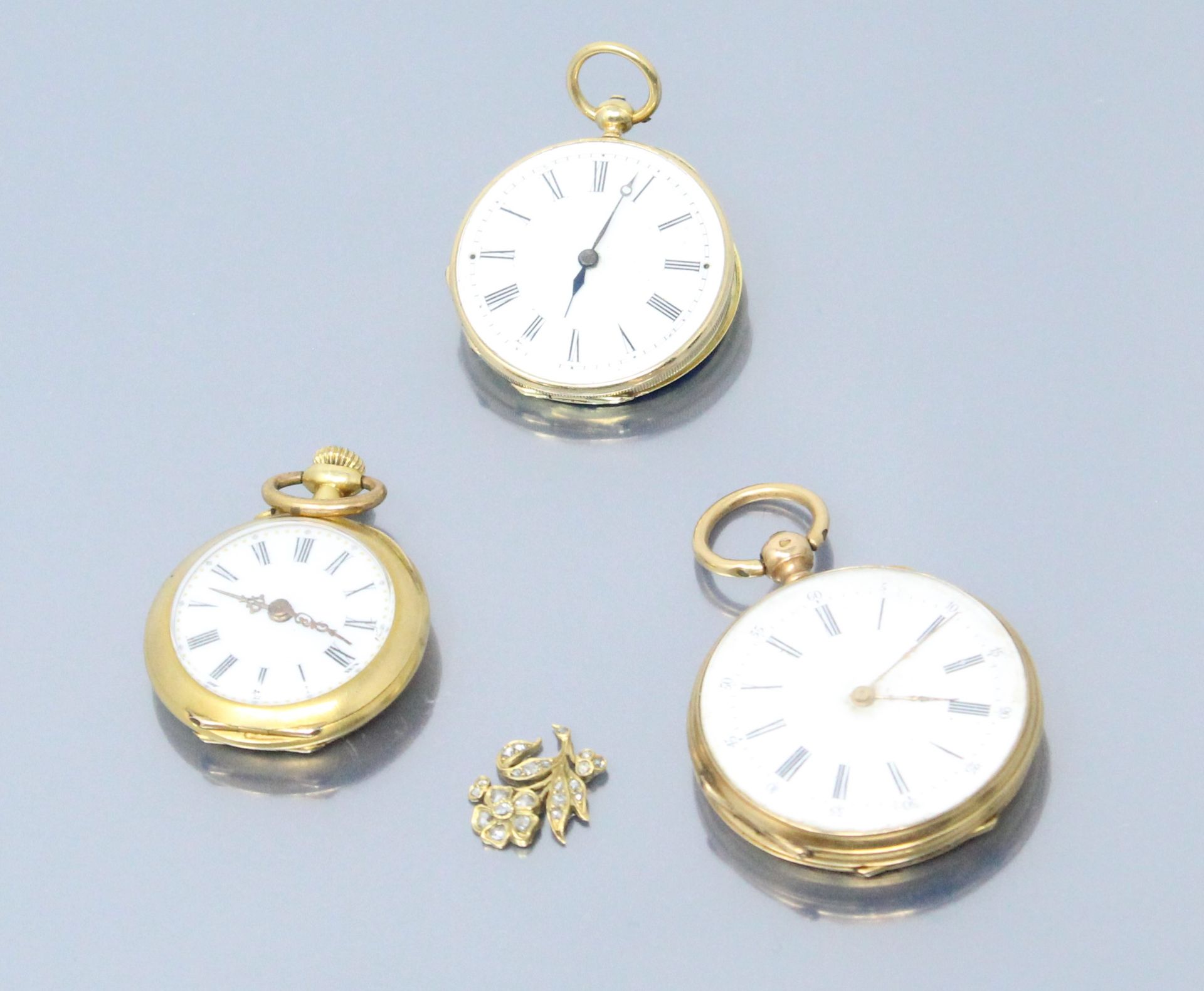 Null 
Lot of three 18k (750) yellow gold collar watches. A gold scrap with diamo&hellip;