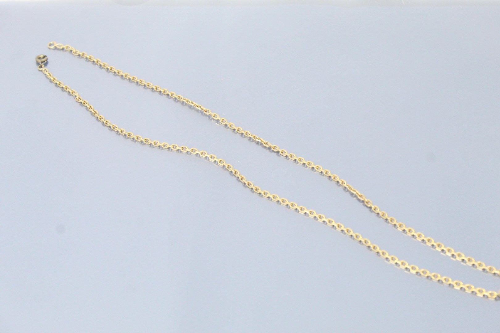Null 18k (750) yellow gold chain. The clasp in metal. 

Eagle head hallmark. 

N&hellip;