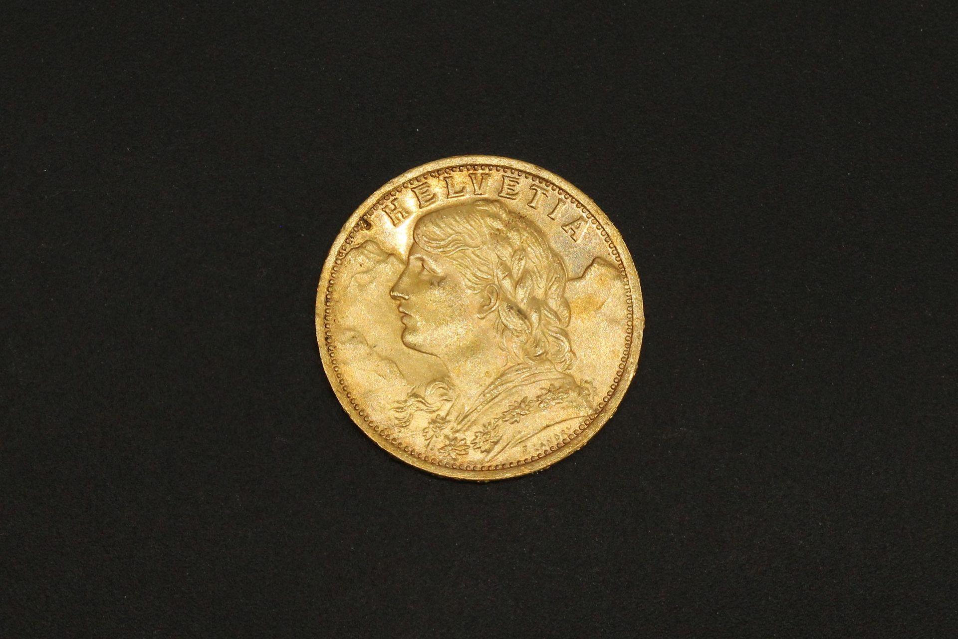 Null 
Gold coin of 20 Swiss francs Vreneli. 1927 B (x1). Weight : 6.45 g - TTB.