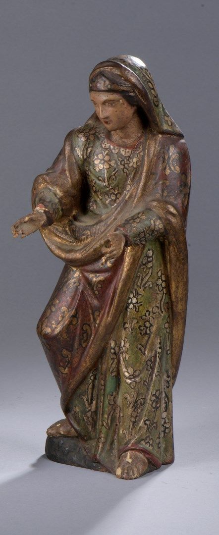 Null 圆雕的圣母或圣女，多色和镀金的木雕。

西班牙殖民地，18/19世纪

H.32,4厘米

(小部件缺失和事故)