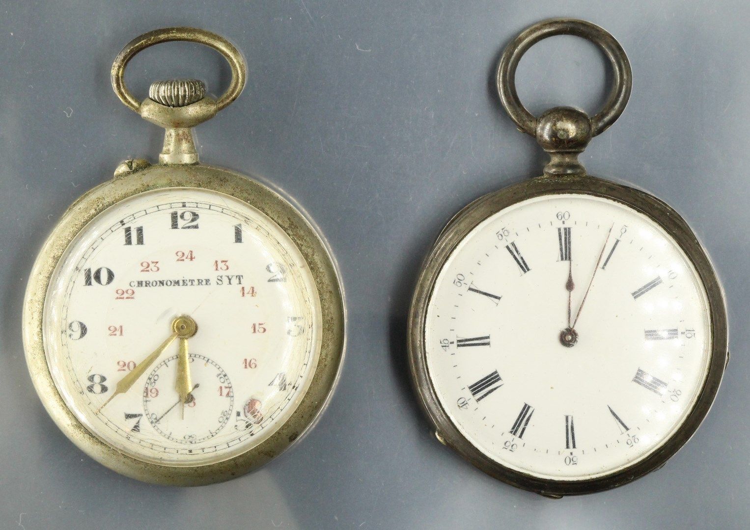 Null Two pocket watches:

- Silver case, hour markers with Roman numerals for th&hellip;