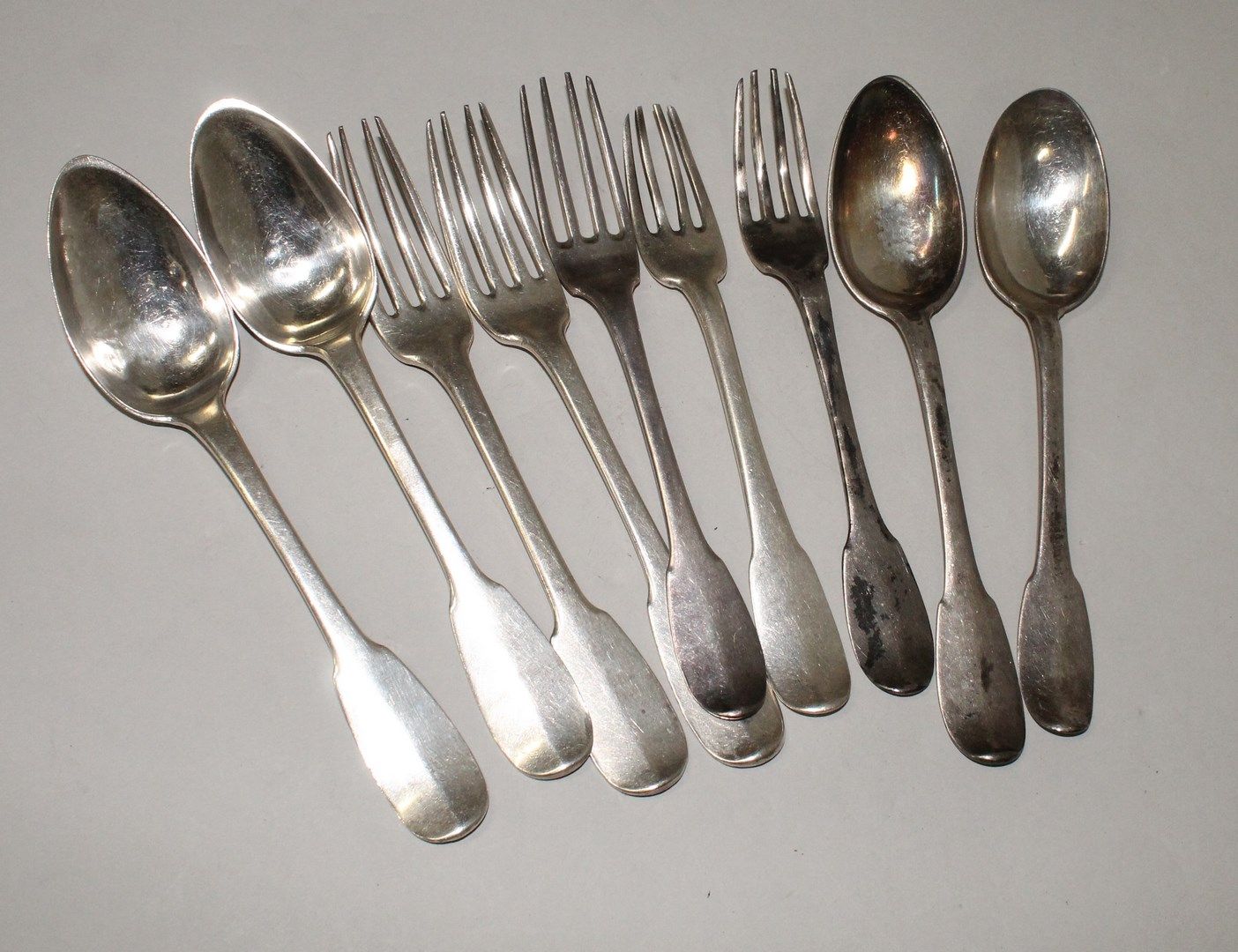 Null A set of mostly 18th century silver flatware, some spatulas monogrammed, va&hellip;