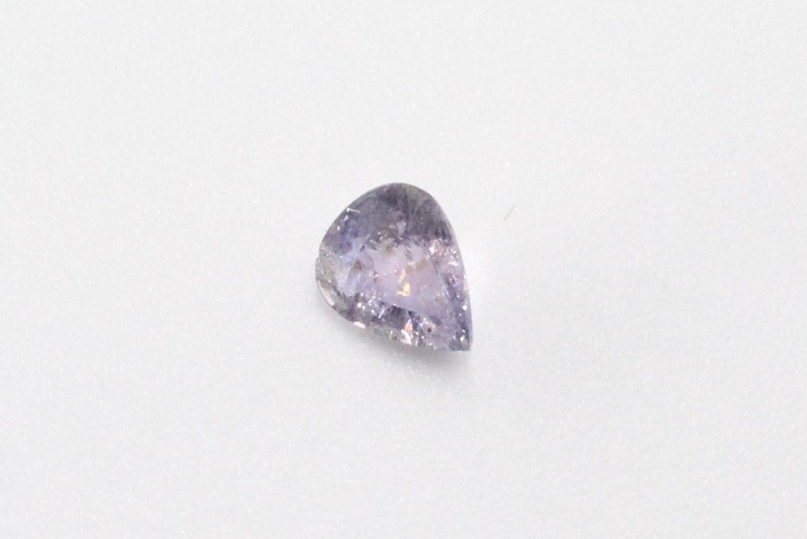 Null Lavender pear sapphire on paper. 

Accompanied by a GIA certificate indicat&hellip;