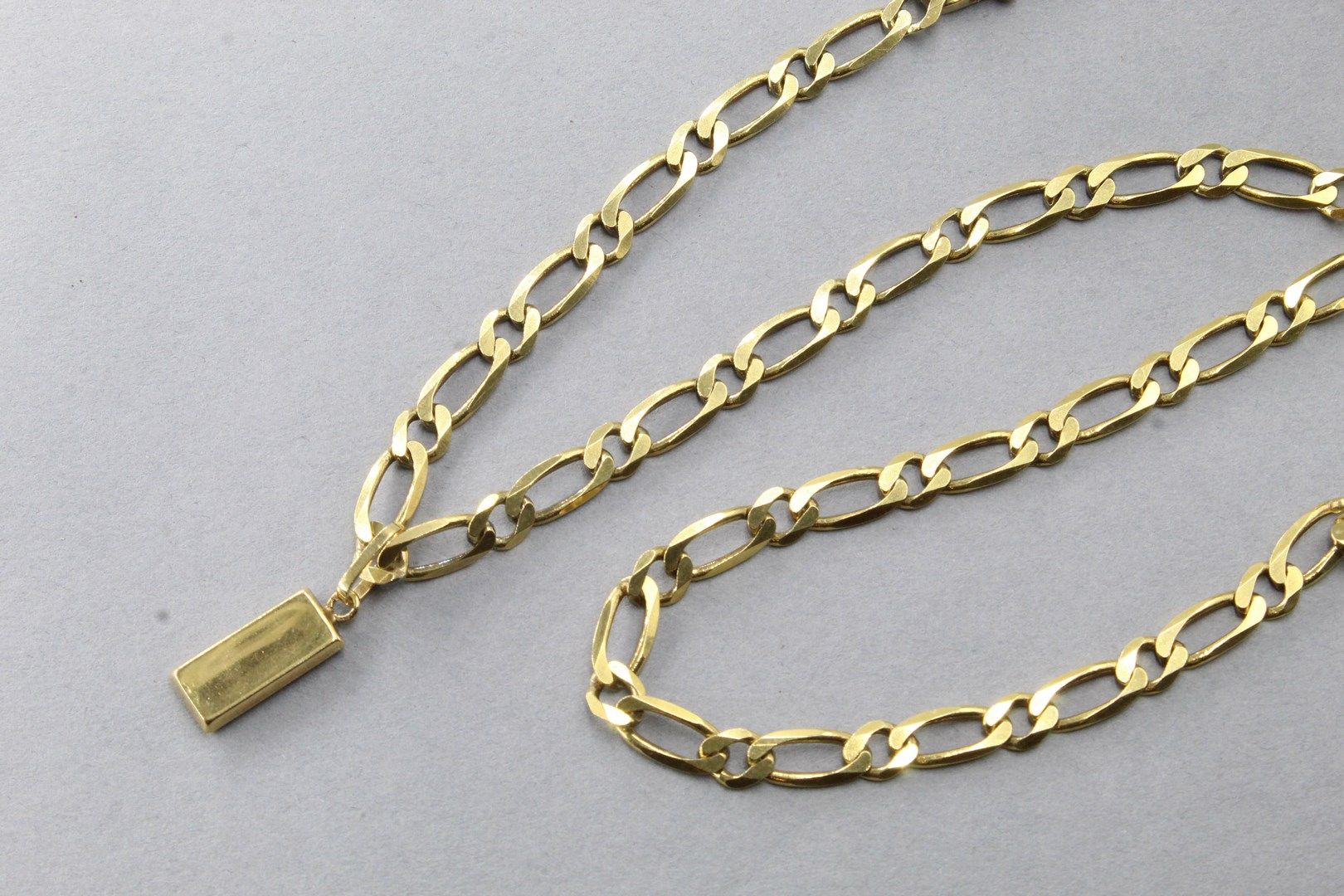 Null 金口袋 "链子，带有18K(750)黄金的路牙链和锭子。



项链尺寸：约49厘米 - 总重量：27.40克。
