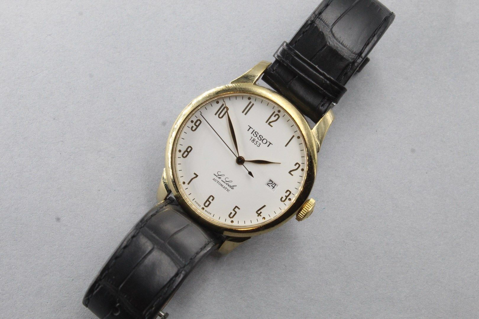 Null TISSOT

Men's wristwatch, Le Locle model, automatic movement, gold Arabic n&hellip;