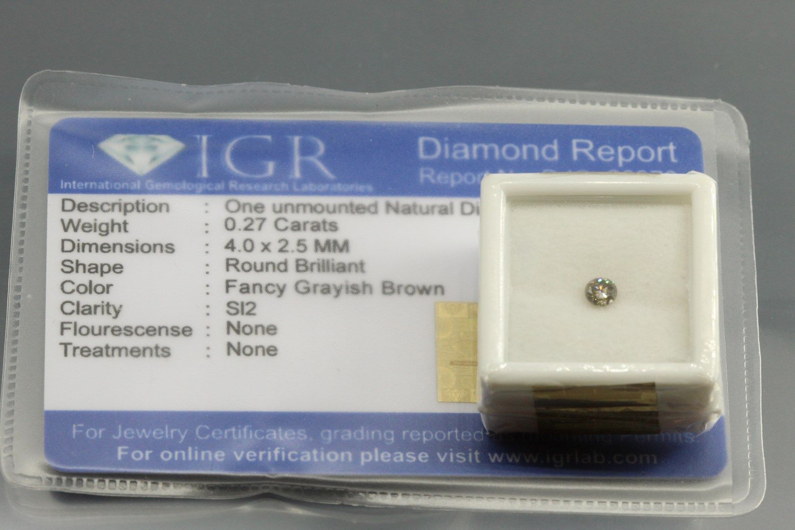 Null Round fancy grayish brown diamond under seal.

Accompanied by a report of t&hellip;