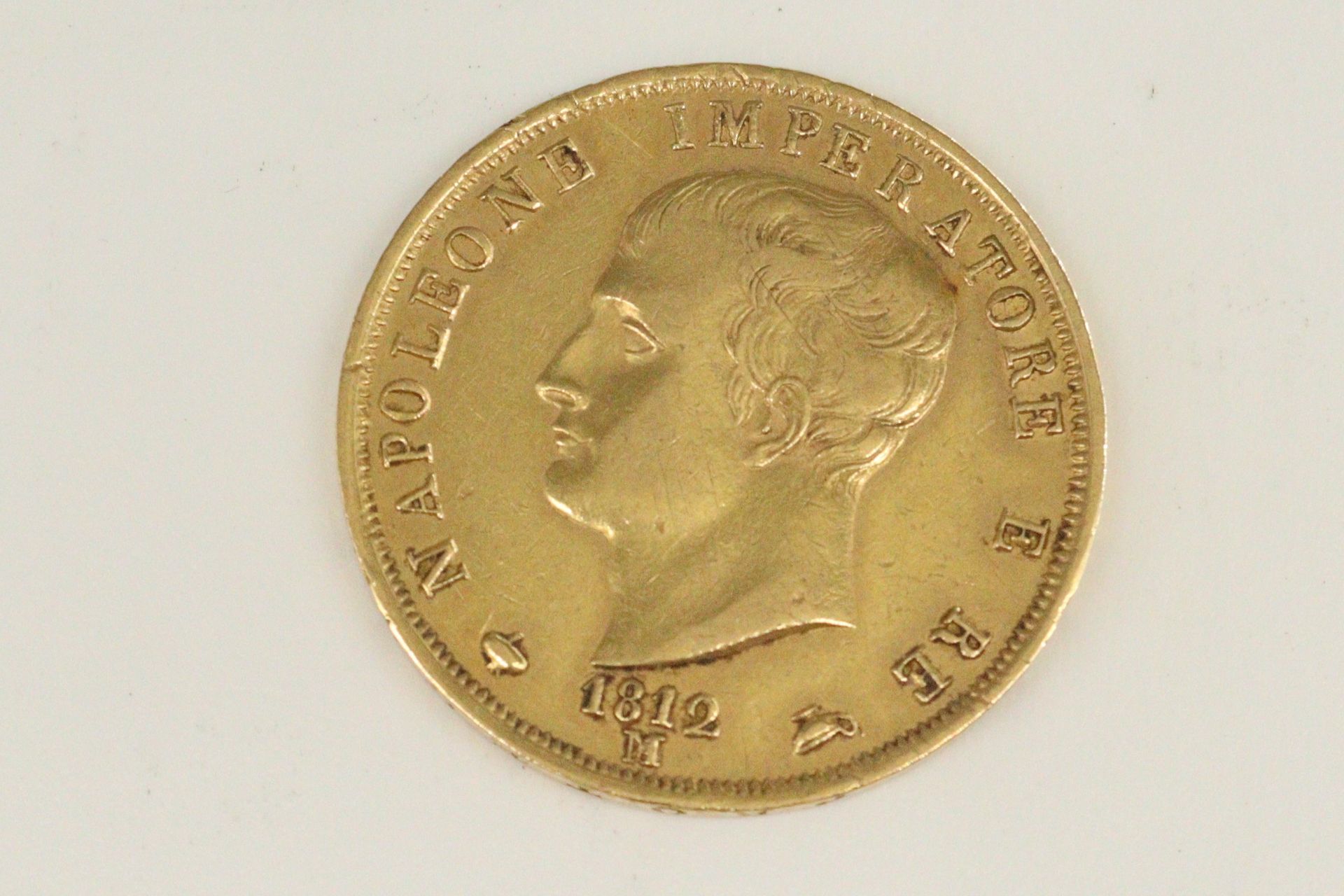 Null 40里拉拿破仑帝王金币(1812 M)

TTB到SUP。

重量：12.84克。