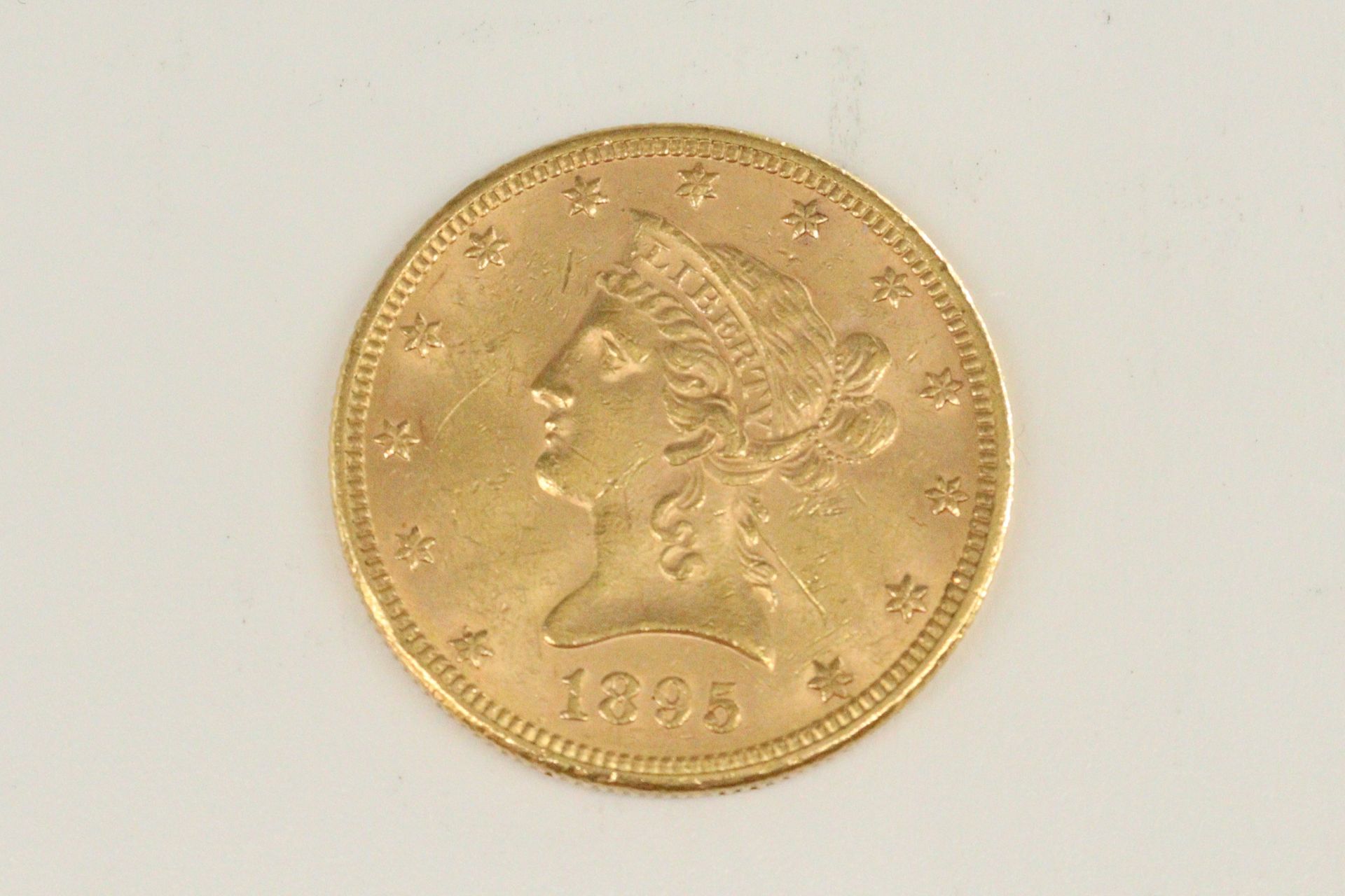Null Ten dollar gold coin Liberty Head (1895)

TTB to SUP.

Weight : 16.69 g.
