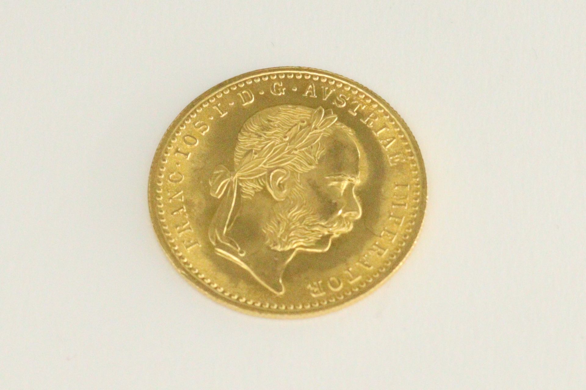 Null Pièce en or d'un ducat François Joseph (1915).

Poids : 3,49 g.