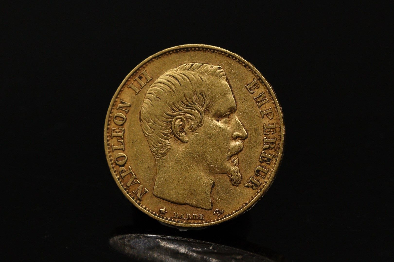 Null Gold coin of 20 Francs Napoleon III (1855)

Weight :6.42g
