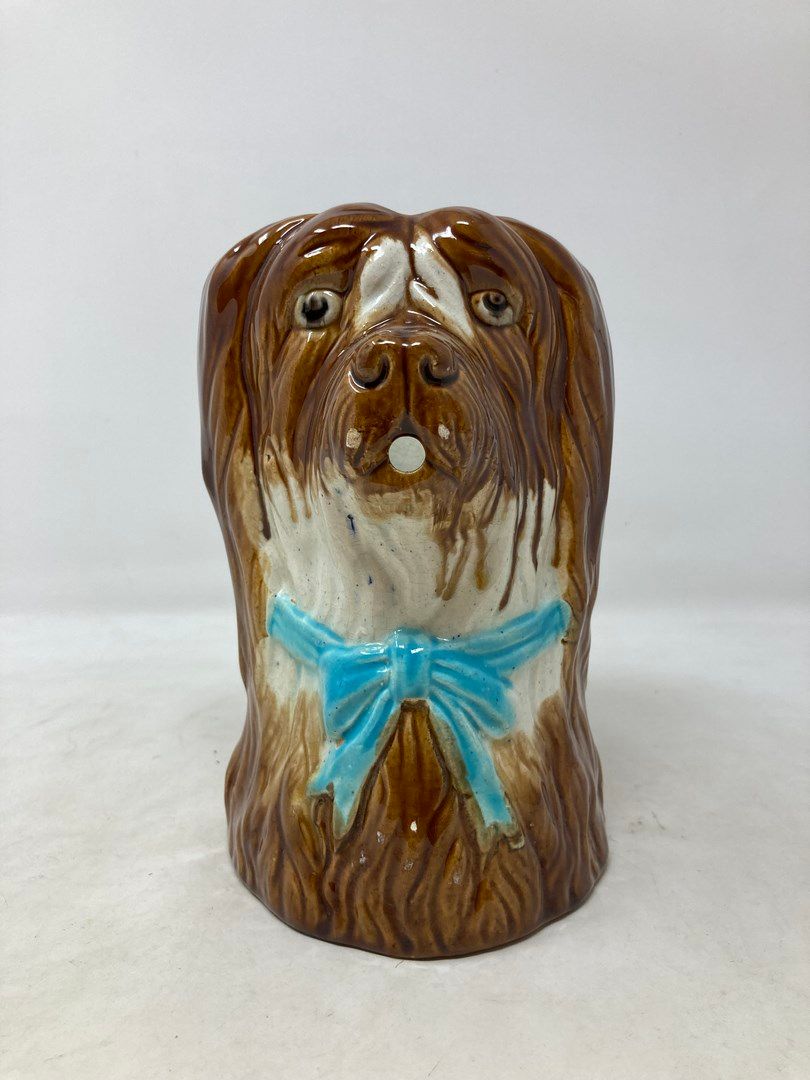 Null Pitcher in barbotine representing a dog with a blue ribbon. Small chip on t&hellip;